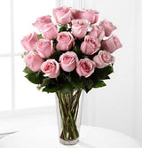 18 pink roses arranged in vase