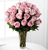 24 pink roses arranged in vase