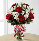 Peppermint Holiday Vase of red and white flowers in vase Medium