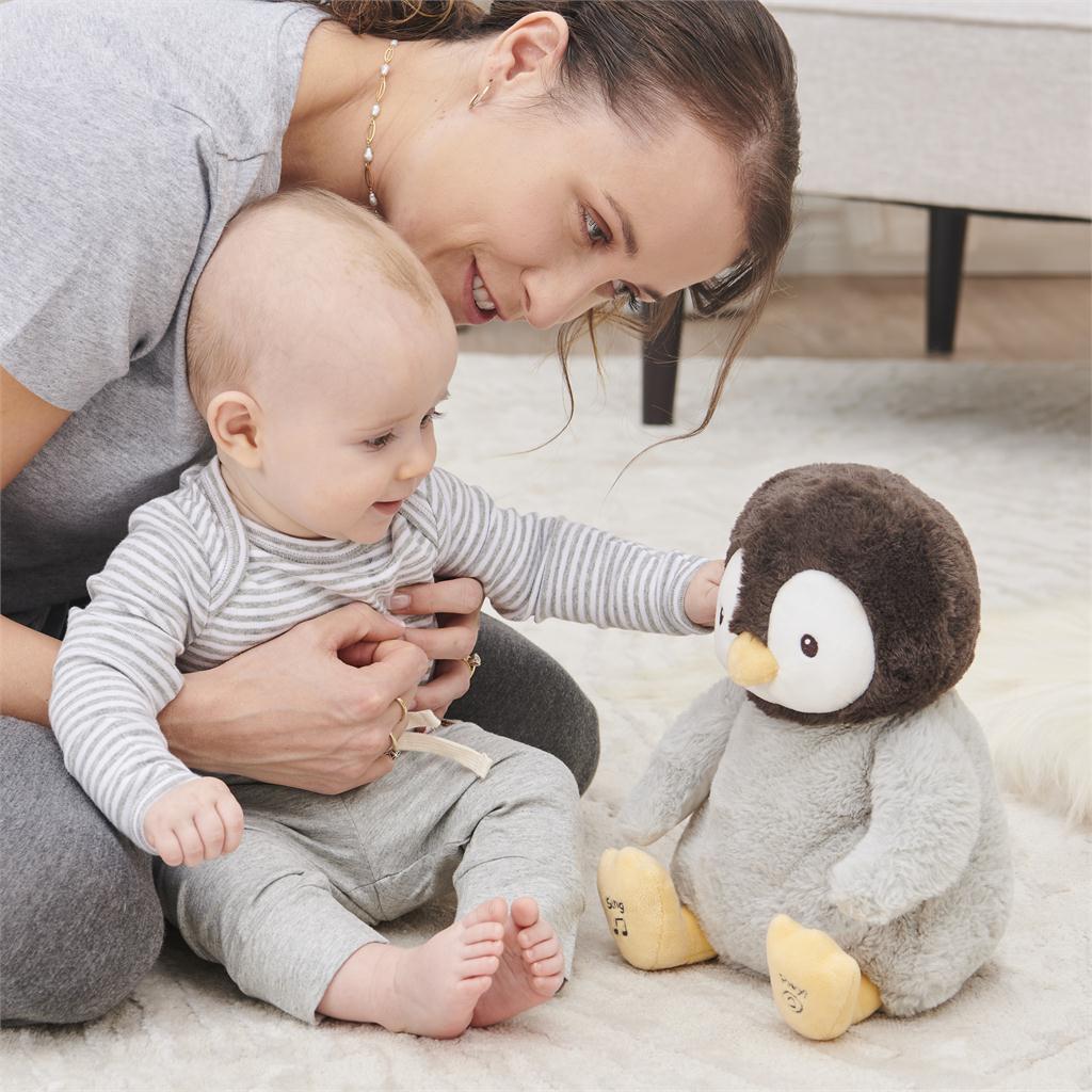 Kissy the Animated Penguin playing with baby