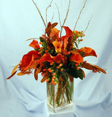 Autumn calla lilies with Fall accents in cylinder vase