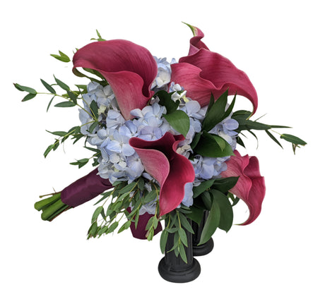 Clutch Bouquet of blue hydrangea with purple calla lilies