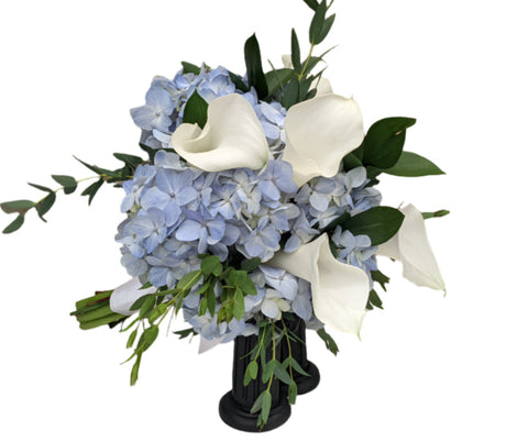 Clutch Bouquet of blue hydrangea with white calla lilies