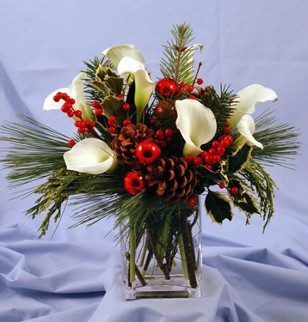 Christmas Calla lilies in cylinder case with pine cones and holiday accents