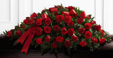 Dearly departed funeral flower half casket spray with all red roses