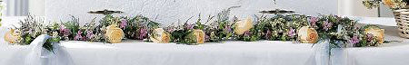 Deluxe funeral casket garland with peach roses and greens