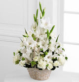 White handle basket filled with assorted white sympathy flowers Medium