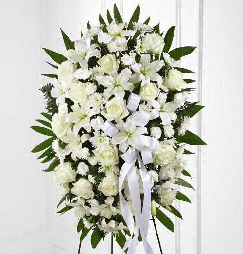 All white flowers in funeral standing spray Medium