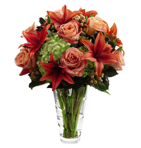 FTD Dawning Delight Bouquet by Vera Wang with assorted orange flowers and green hydrangea Large