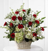 White sympathy basket arrangement of fresh lilies