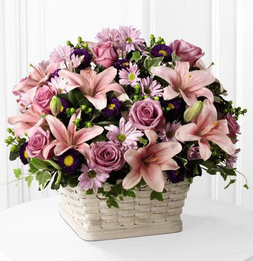 Sympathy basket of flowers in shades of pink and purple Large