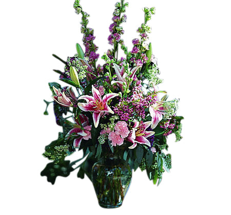 Pink and purple assorted flowers in vase with stargazer lilies