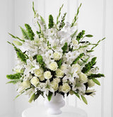 Morning stars funeral flower arrangement of all white flowers in a white urn Large