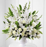 Morning stars funeral flower arrangement of all white flowers in a white urn Medium