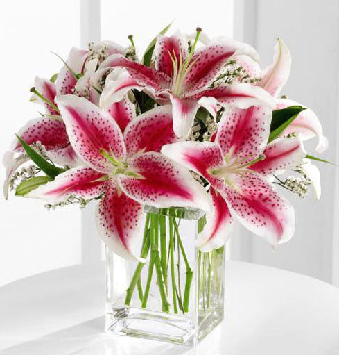 Pretty pink stargazer lilies in vase Medium