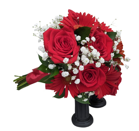 Red rose and red gerbera daisy clutch bouquet for prom