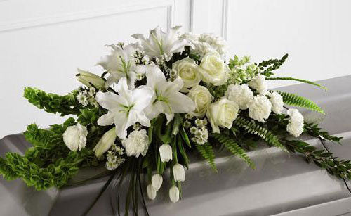 Resurrection funeral flower casket spray of assorted white flowers Medium