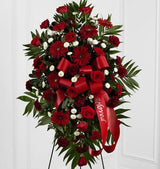 Red and white funeral flower standing spray with red bow Medium