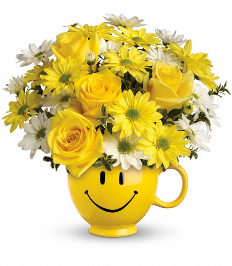 Teleflora Be Happy Yellow Smiley Face Mug with flowers Deluxe