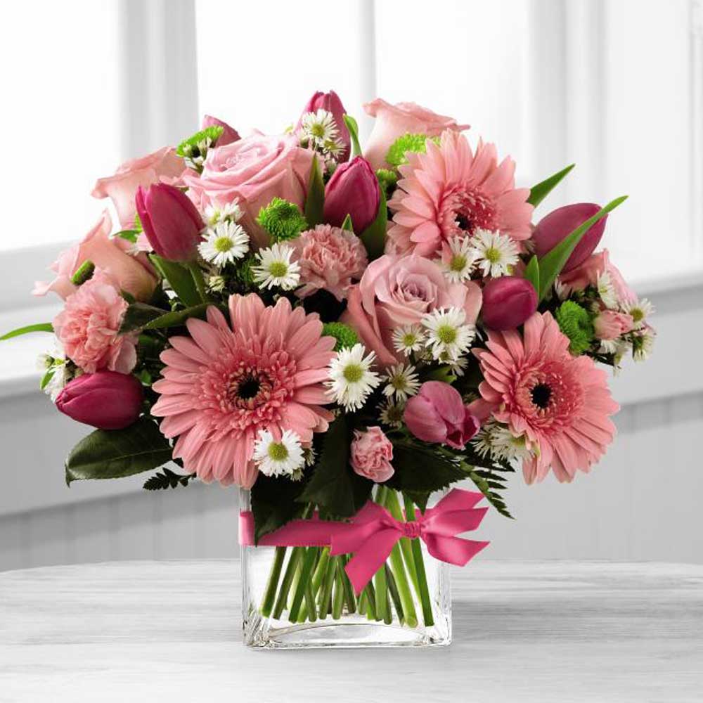 Blooming Visions Bouquet of assorted pink flowers in glass cube Exquisite