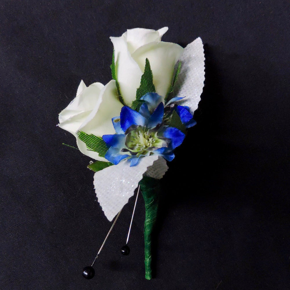 Blue and white silk flower boutonniere