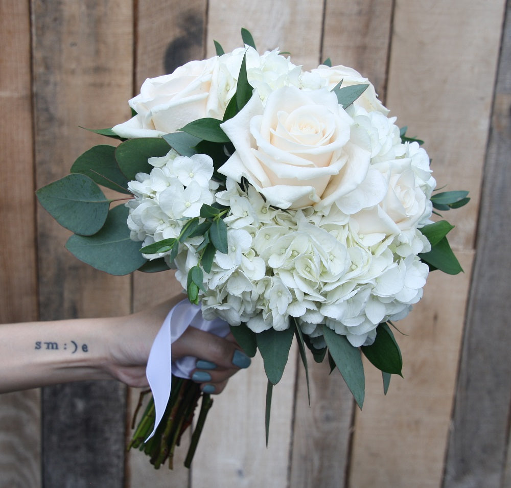 Bridal bouquet of white and cream flowers