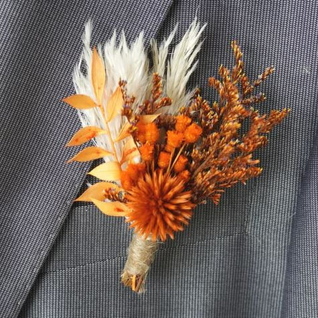 Burnt orange dried flower boutonniere