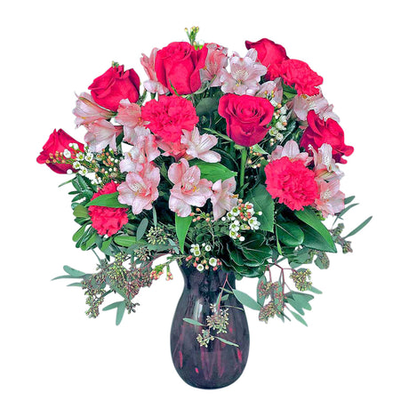 Enchantment vase of assorted pink and red flowers in red glass vase large