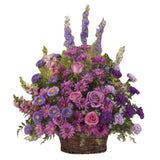 Gracious lavender funeral basket arrangement of all purple flowers