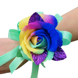 Vibrant rainbow silk corsage with purple, glitter leaves and mint green bow. 