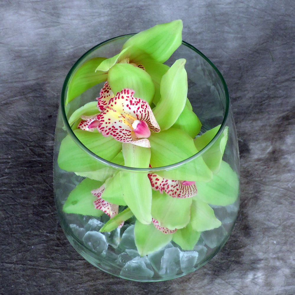 Close up of orchid in glass container