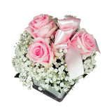 Top of pink rose and babies breath cube bouquet