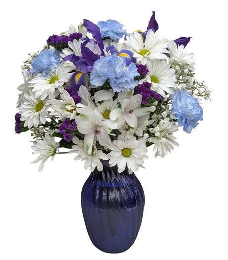 Blue and white fresh flowers in a blue glass vase Deluxe