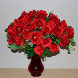 Two dozen silk red roses arranged in vase