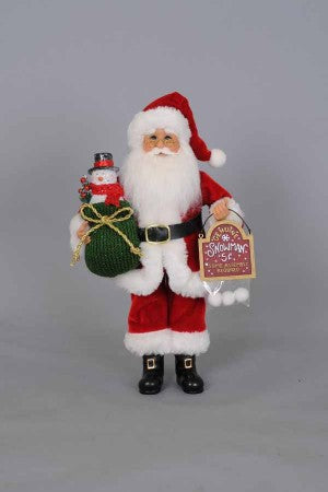 Tabletop Santa figurine with snowballs