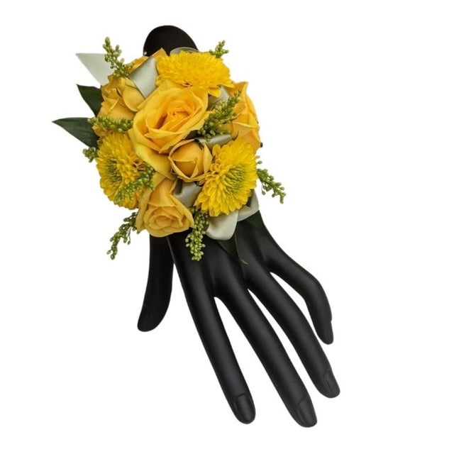 Wristlet corsage of yellow spray roses