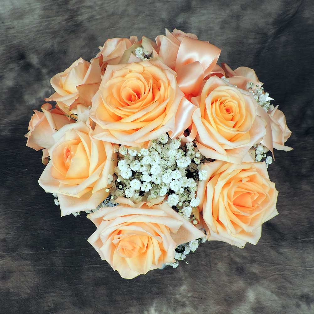 Top of peach rose and babies breath cube bouquet