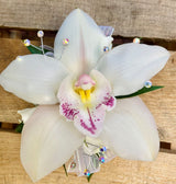 White orchid corsage with rhinestone accents