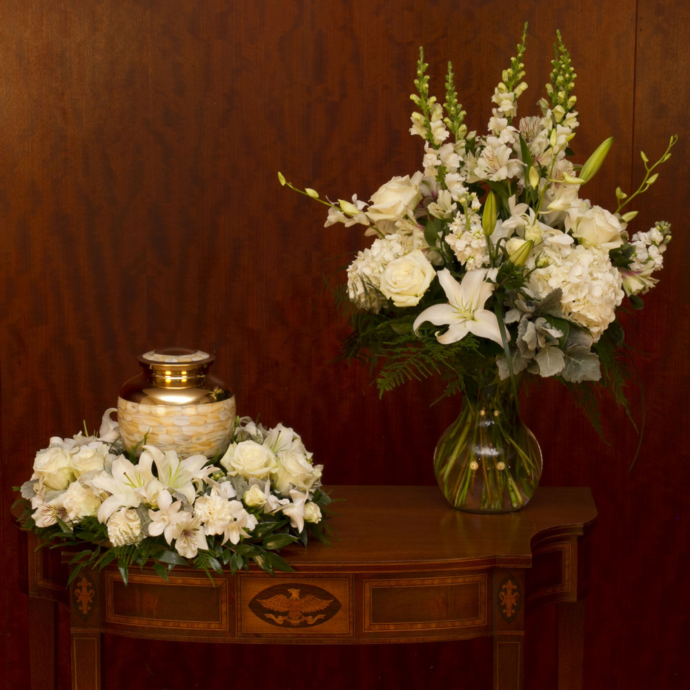 White flowers around urn and vase arrangement