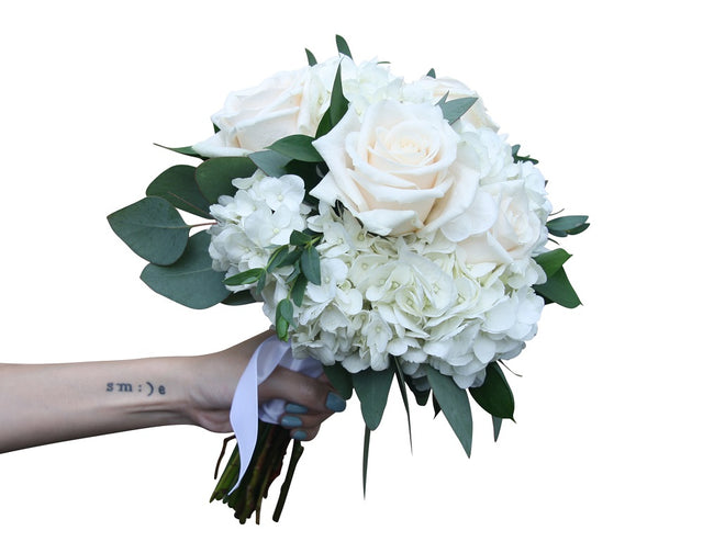 Bridal bouquet of white and cream flowers